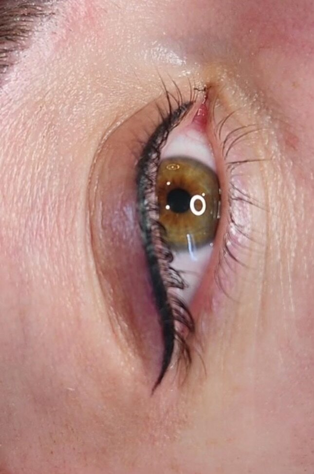 Designer permanent eyeliner with a lifted wing